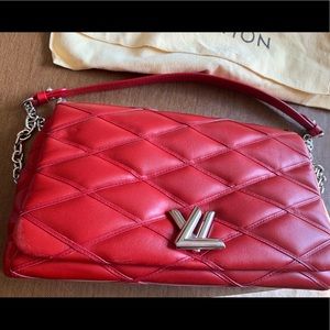 Red quilted Louis Vuitton handbag